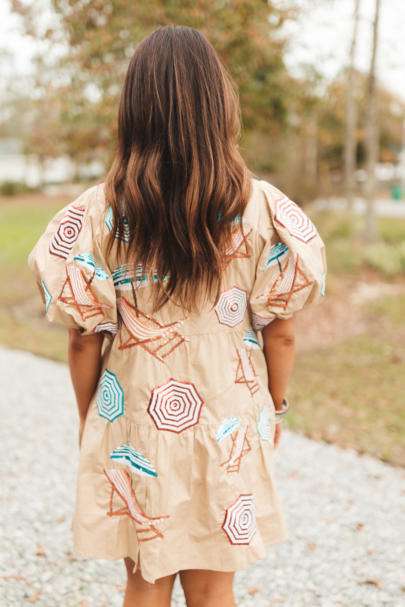 Queen Of Sparkles Tan Umbrella & Chairs Poof Sleeve Dress