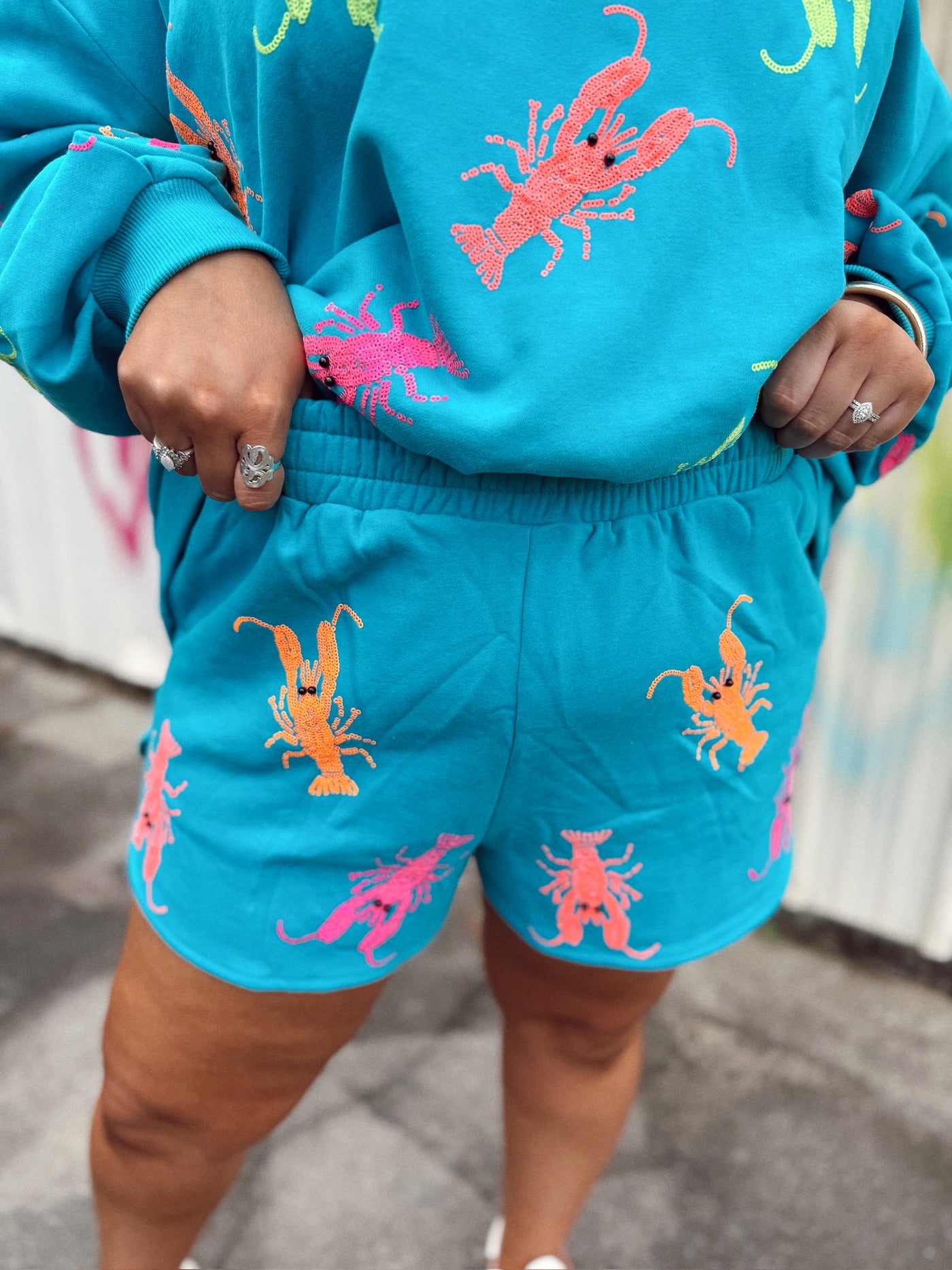 Queen of Sparkles Teal Neon Crawfish Short