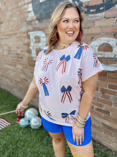 Queen of Sparkles Light Pink Red, White & Blue Scattered Bow Tee